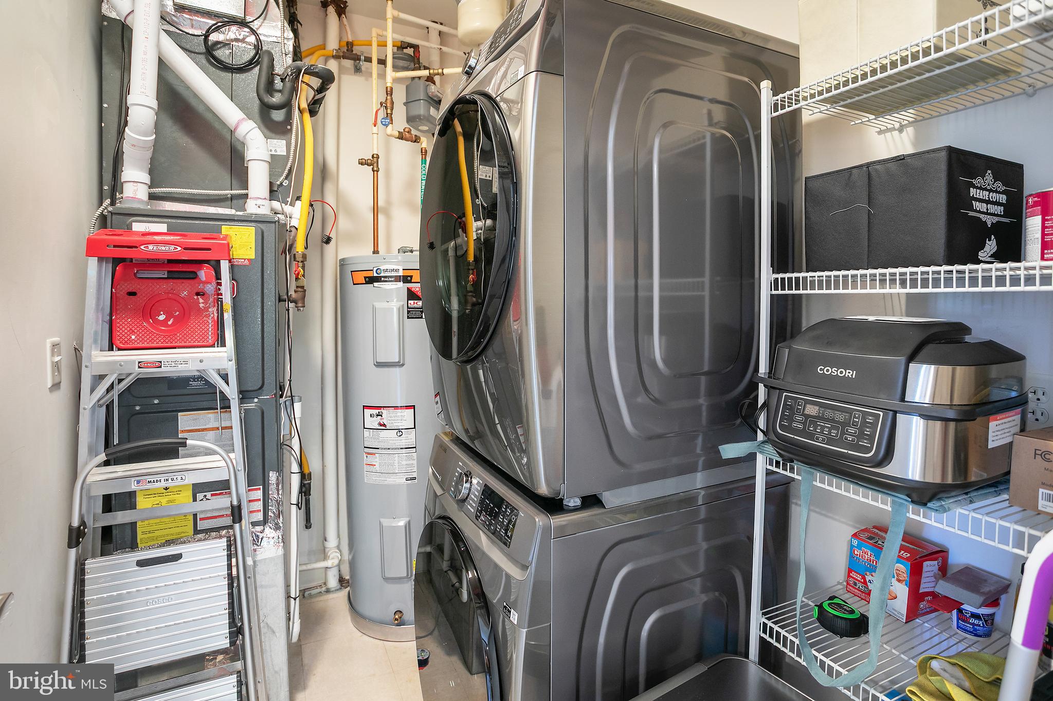 400 Cameron Station Boulevard, Unit 308 Alexandria, VA 22304 - Photo 20 of 46 a utility room with dryer and washer