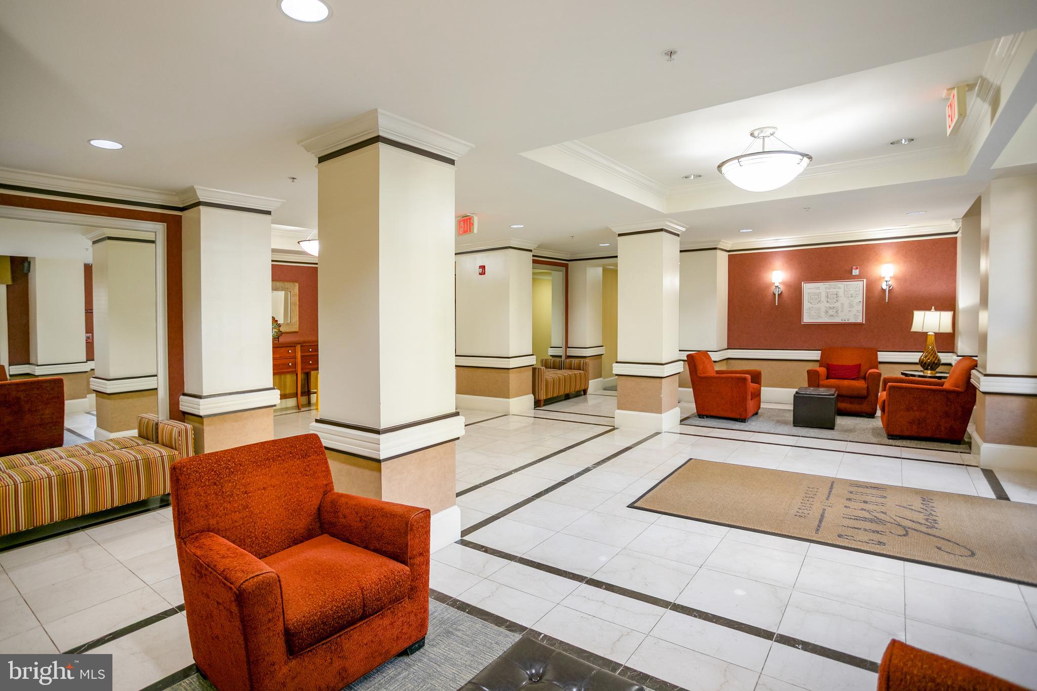 400 Cameron Station Boulevard, Unit 308 Alexandria, VA 22304 - Photo 23 of 46 a living room with furniture kitchen view and a large window