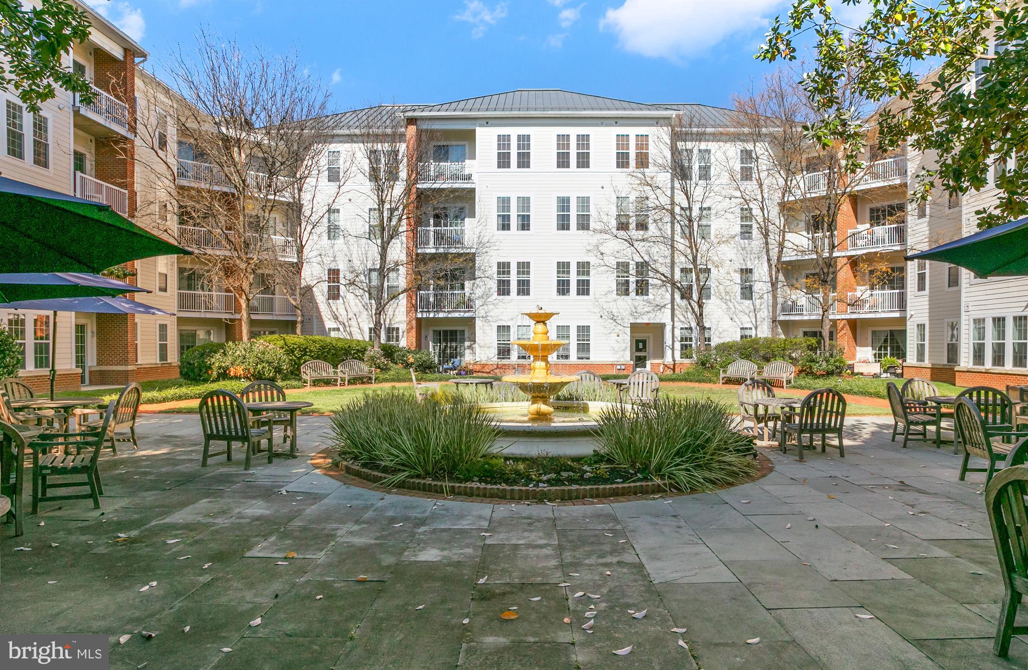 400 Cameron Station Boulevard, Unit 308 Alexandria, VA 22304 - Photo 25 of 46 a front view of a building with outdoor seating