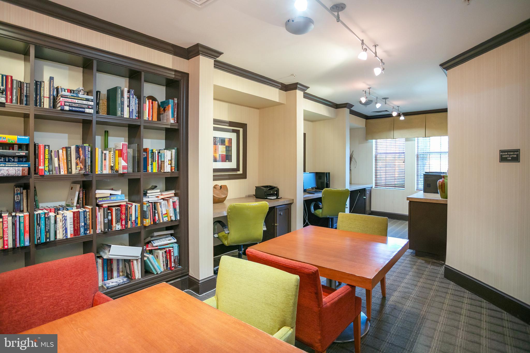 400 Cameron Station Boulevard, Unit 308 Alexandria, VA 22304 - Photo 29 of 46 a room with furniture and a book shelf
