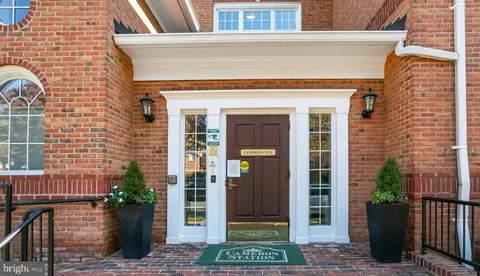 a sign board with yellow lighting in front of it