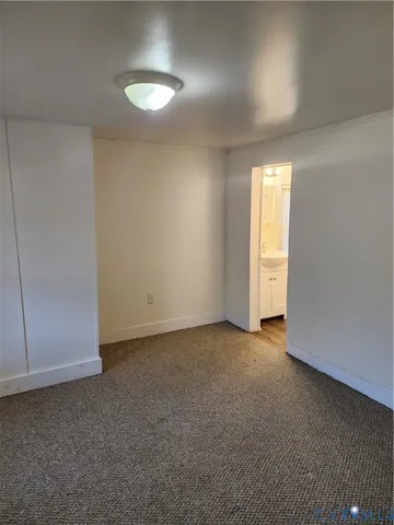 an empty room with a empty space and windows