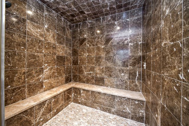 a view of living room with furniture and a chandelier