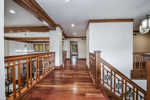 a kitchen with stainless steel appliances kitchen island granite countertop a refrigerator and a stove top oven