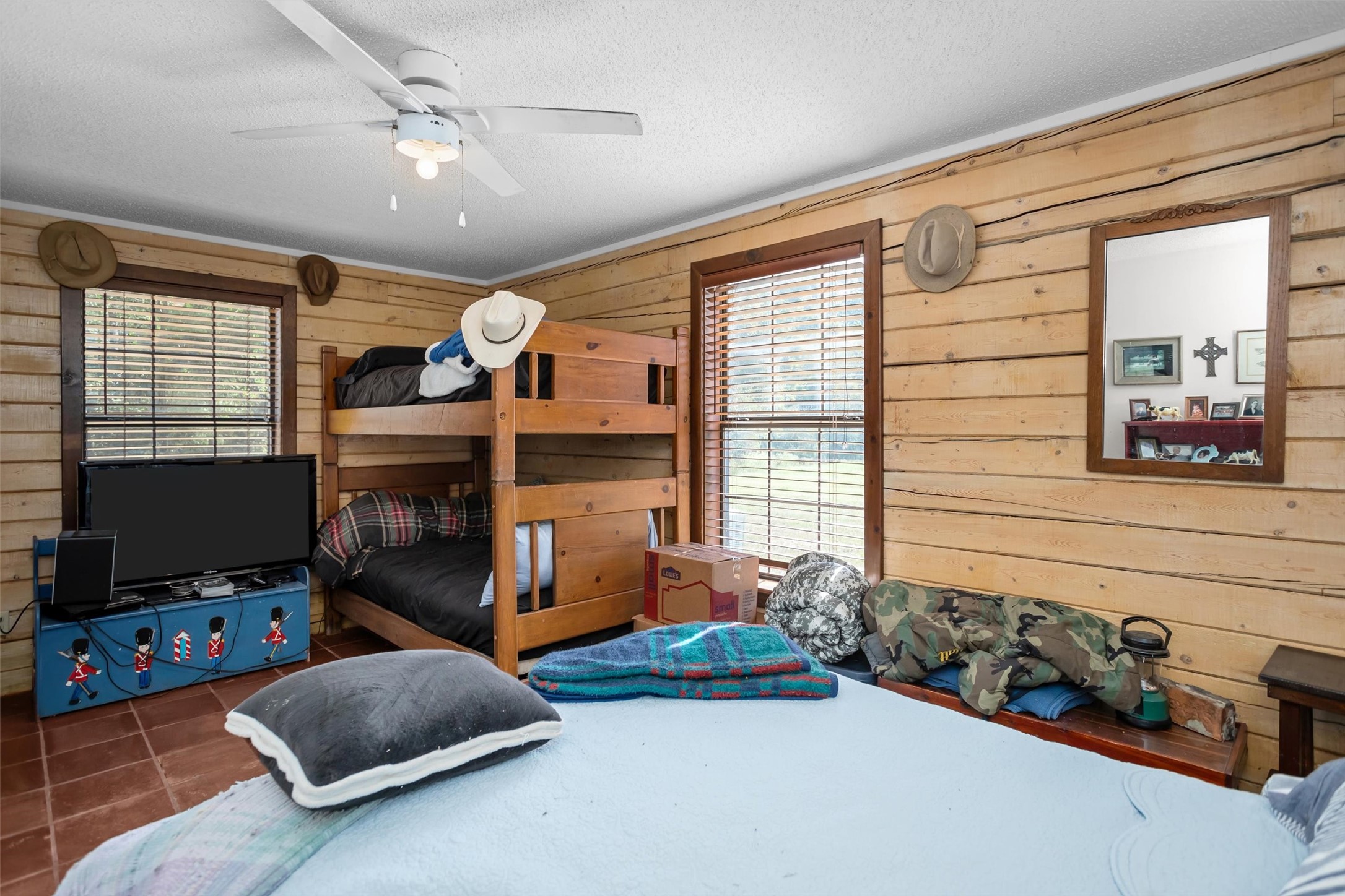 120 Fsr 513 Kennard, TX 75847 - Photo 21 of 47 a bedroom with furniture a flat screen tv and a window