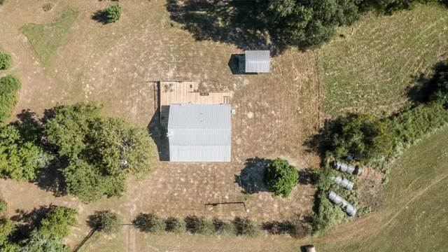 a aerial view of a house with a yard