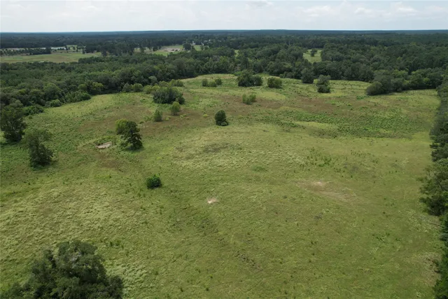 a front view of a house with a park
