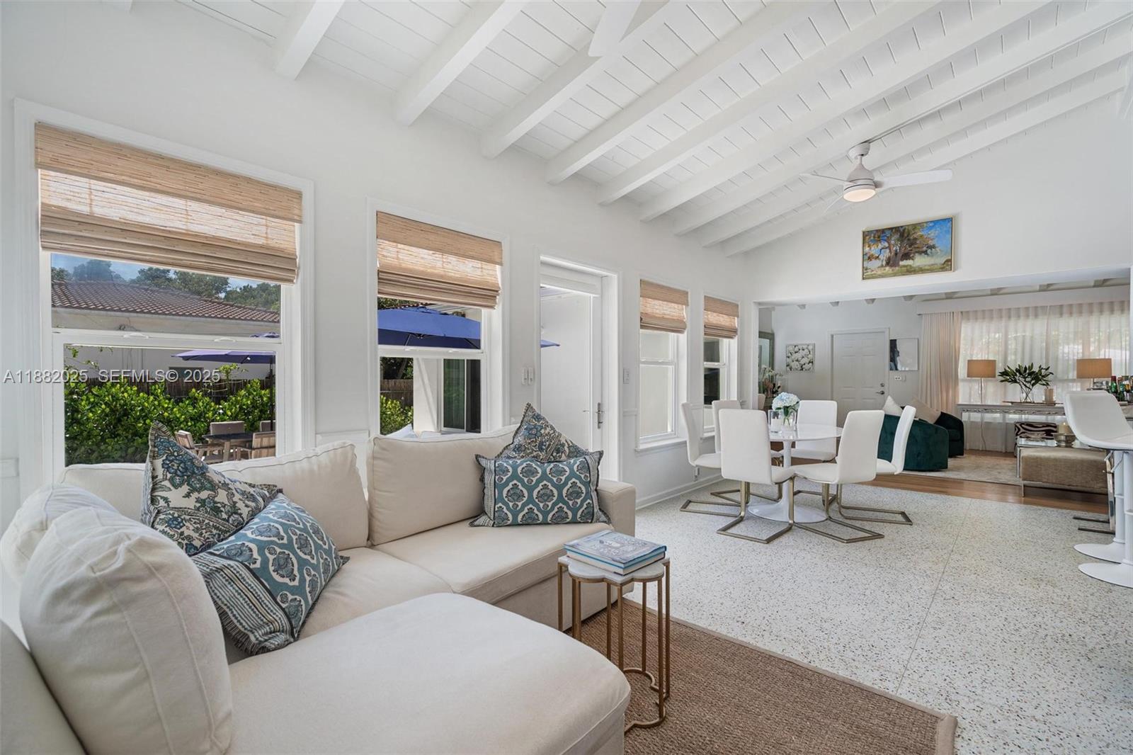 9357 Northeast 9th Place Miami Shores, FL 33138 - Photo 11 of 51 a living room with furniture and a large window