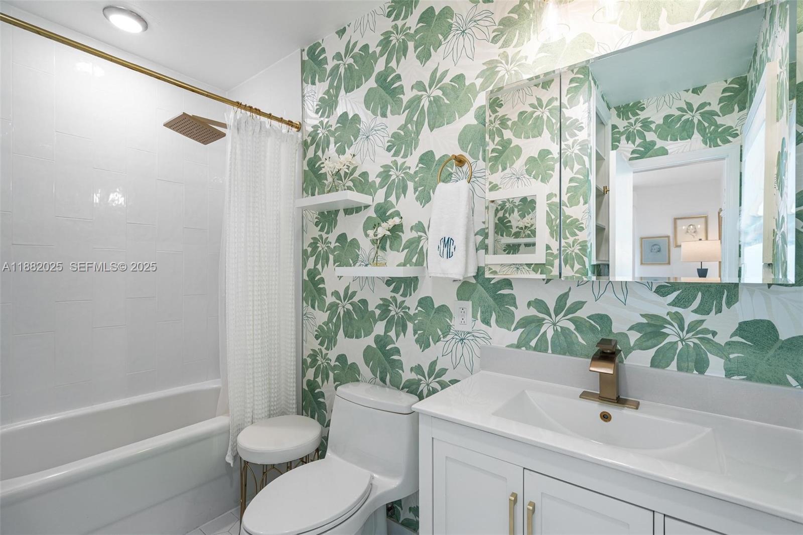 9357 Northeast 9th Place Miami Shores, FL 33138 - Photo 21 of 51 a bathroom with a sink toilet and shower