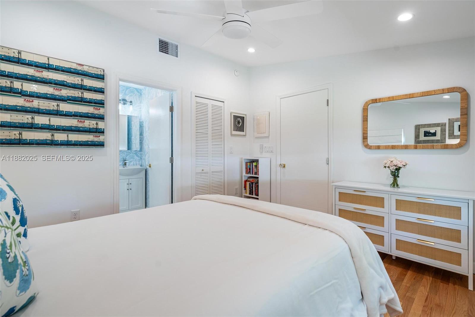 9357 Northeast 9th Place Miami Shores, FL 33138 - Photo 28 of 51 a bedroom with a bed and a flat screen tv