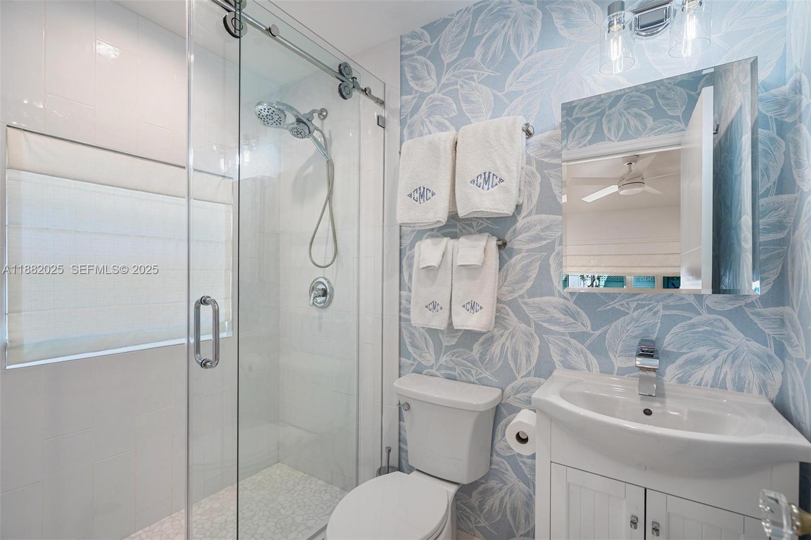 9357 Northeast 9th Place Miami Shores, FL 33138 - Photo 29 of 51 a bathroom with a sink toilet and shower