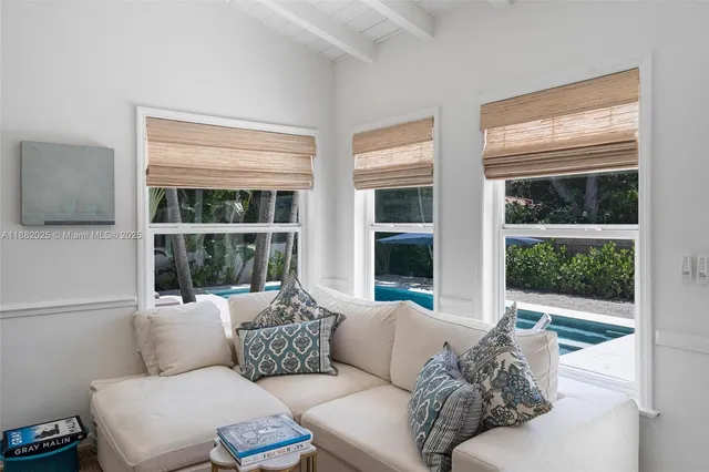 a living room with furniture and windows