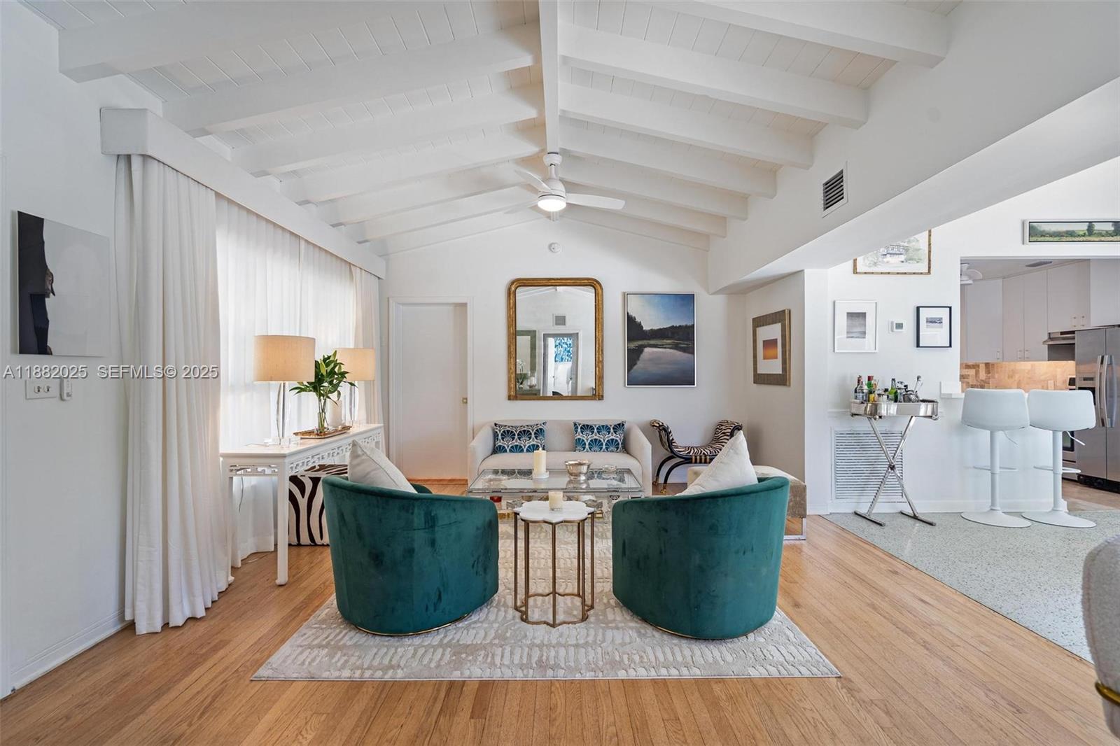 9357 Northeast 9th Place Miami Shores, FL 33138 - Photo 4 of 51 a dining room with furniture and wooden floor