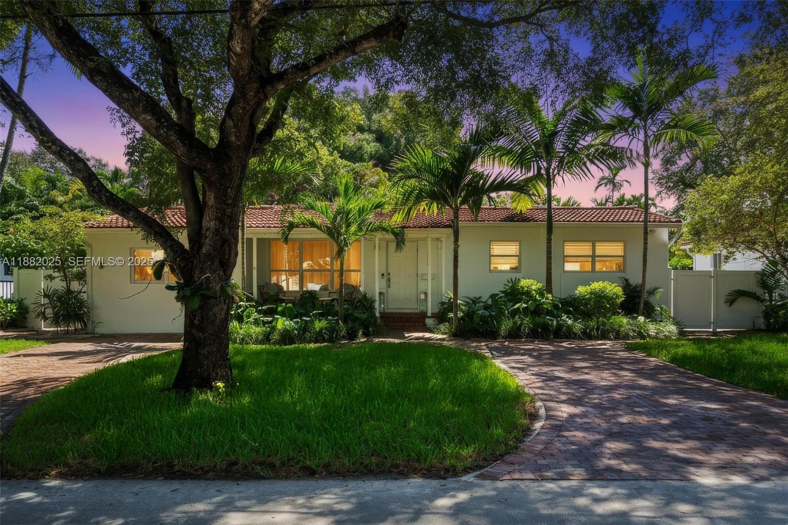 9357 Northeast 9th Place Miami Shores, FL 33138 - Photo 42 of 51 a front view of a house with garden