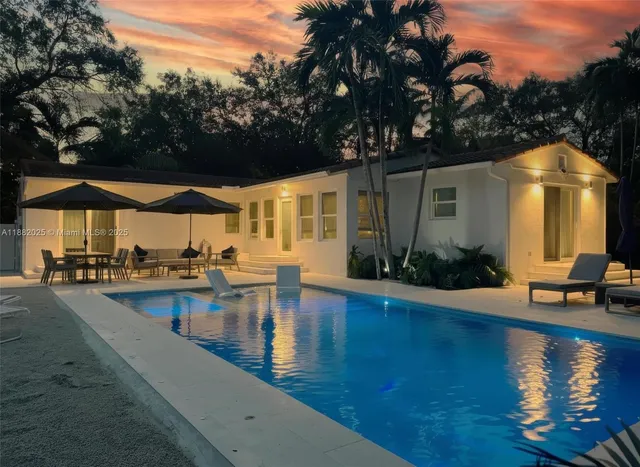 a view of a swimming pool with a patio