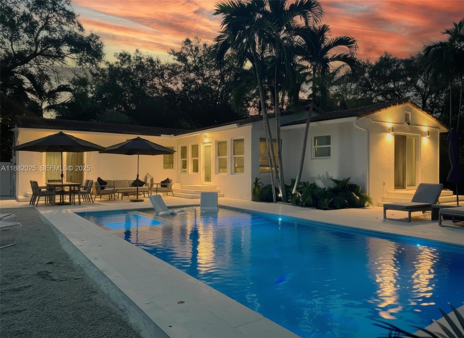 9357 Northeast 9th Place Miami Shores, FL 33138 - Photo 43 of 51 a view of a swimming pool with a patio