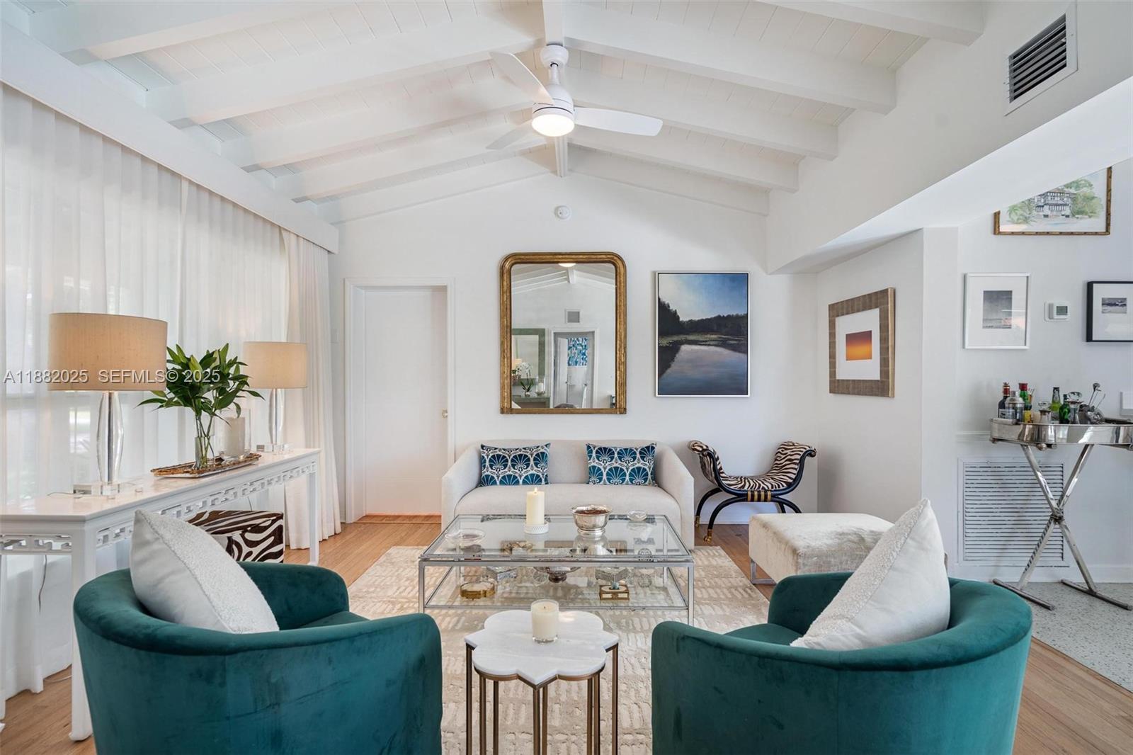 9357 Northeast 9th Place Miami Shores, FL 33138 - Photo 5 of 51 a living room with furniture and a potted plant