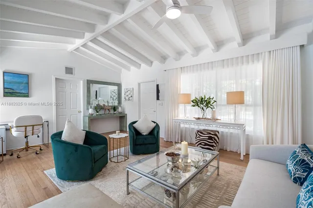 a living room with furniture and a table