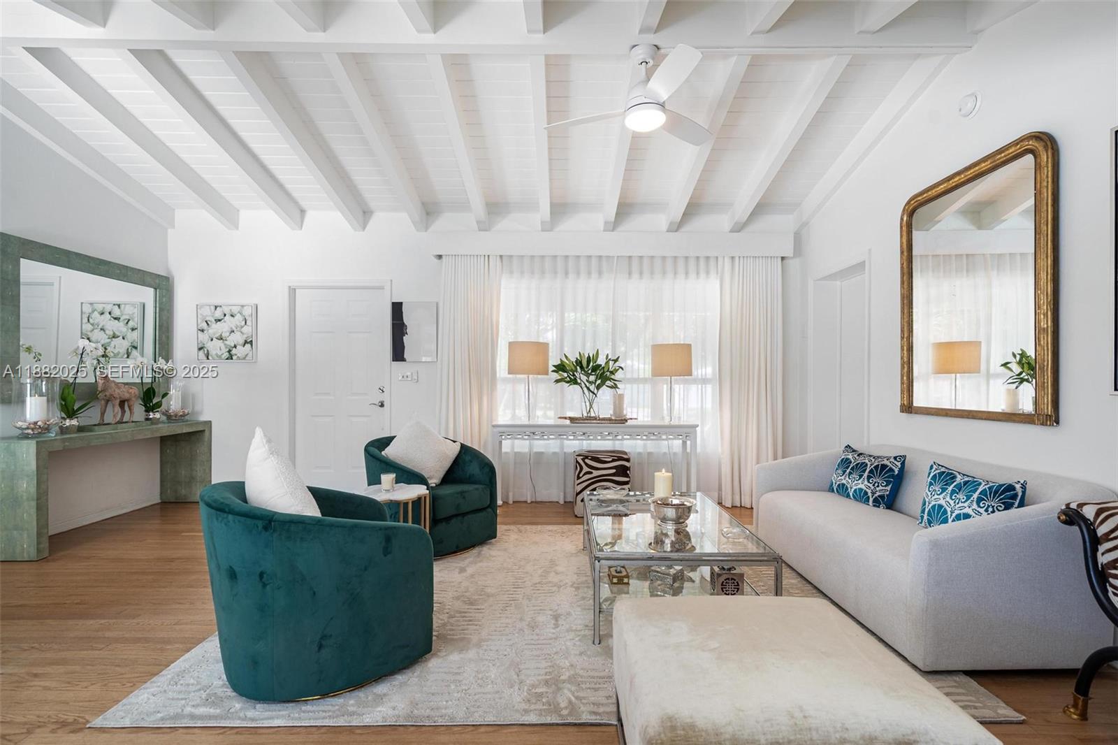 9357 Northeast 9th Place Miami Shores, FL 33138 - Photo 8 of 51 a living room with furniture and view of kitchen