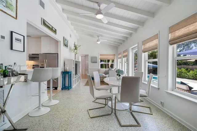 a view of a livingroom with furniture and a potted plant