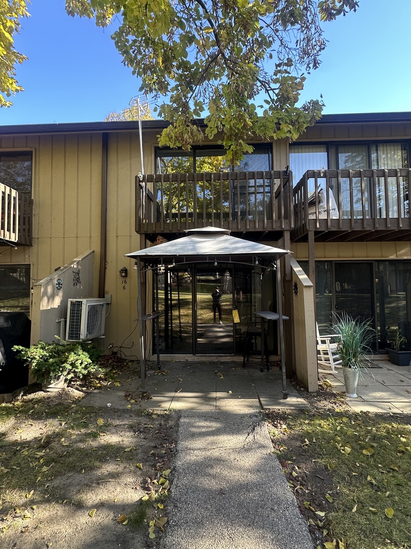 16 St Thomas Colony Street, Unit 6 Fox Lake, IL 60020 - Photo 1 of 10 a front view of a house