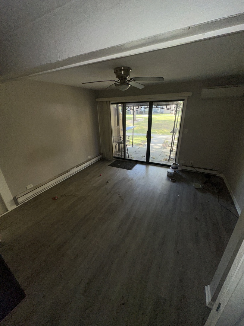 16 St Thomas Colony Street, Unit 6 Fox Lake, IL 60020 - Photo 3 of 10 wooden floor in an empty room