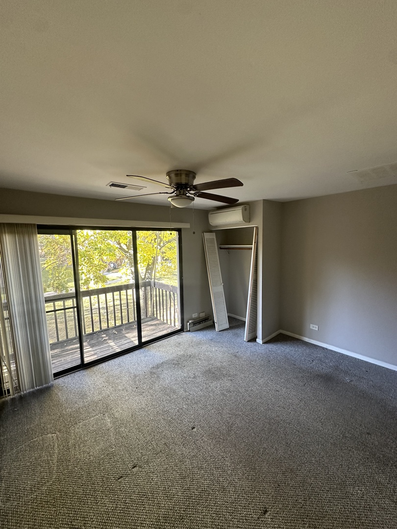 16 St Thomas Colony Street, Unit 6 Fox Lake, IL 60020 - Photo 7 of 10 an empty room with windows