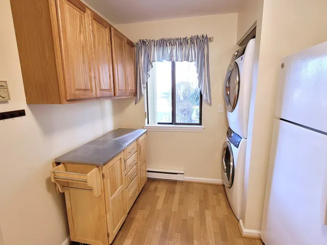 a storage room with wooden floor and furniture