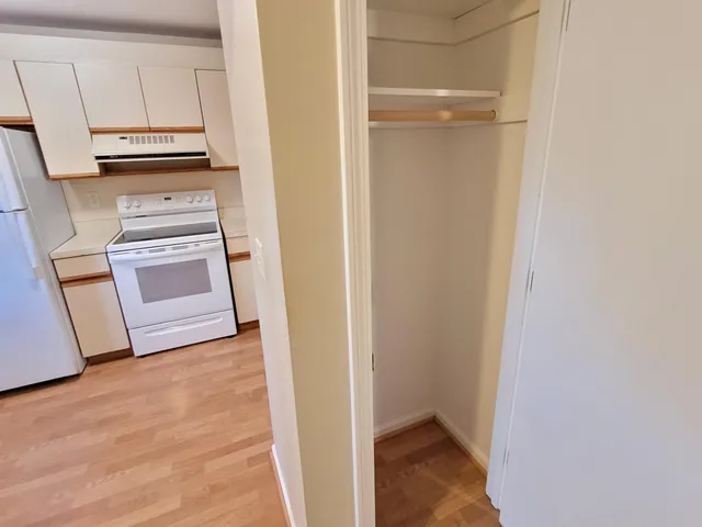 a view of kitchen and wooden floor