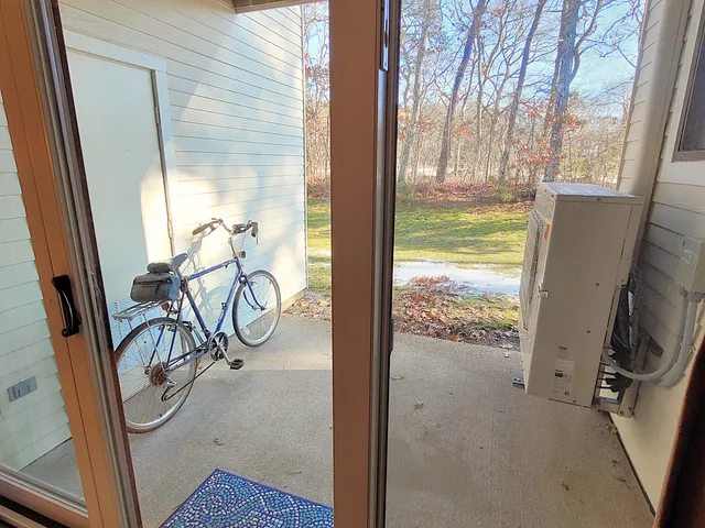a view of a room with window and furniture