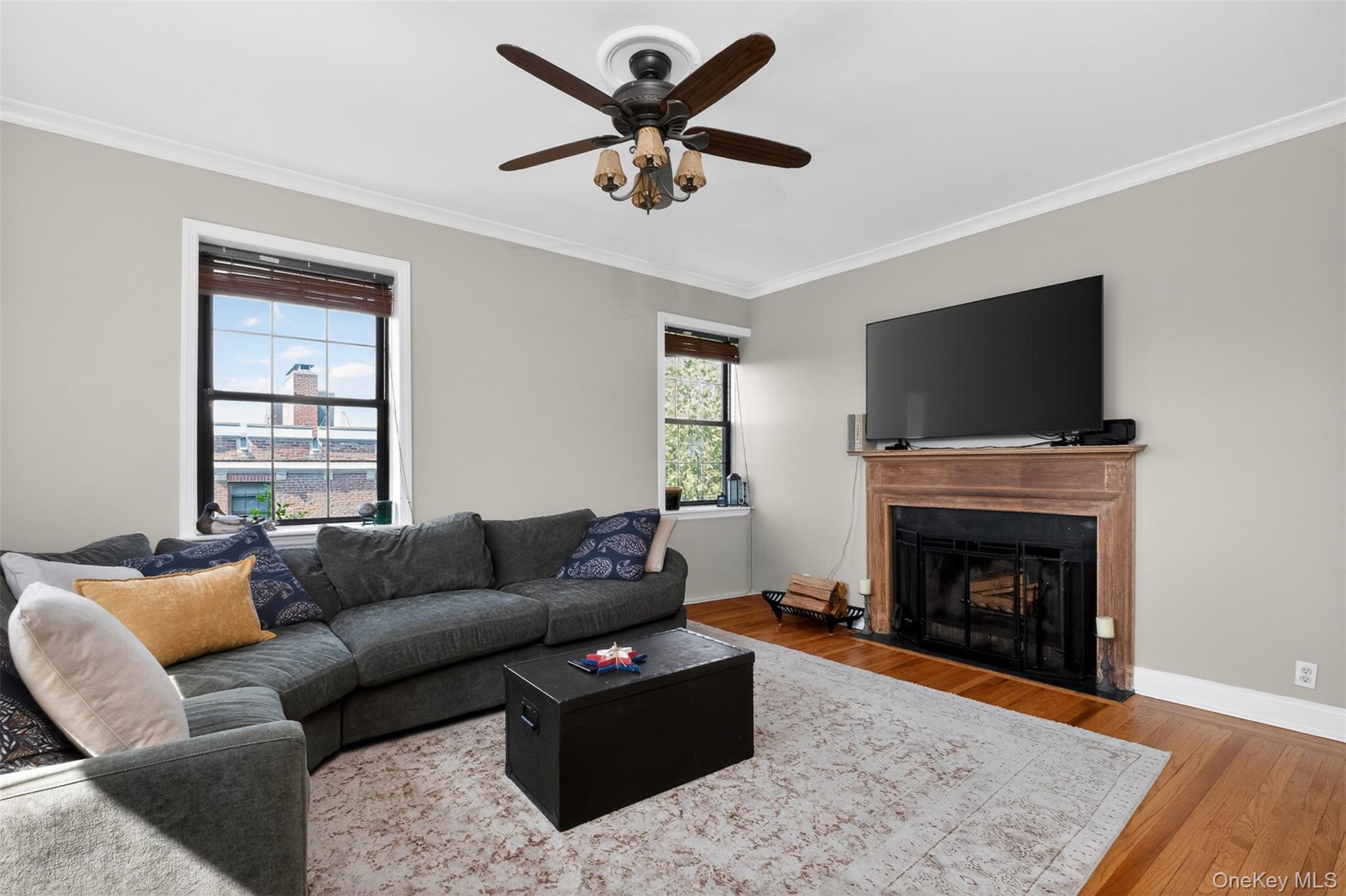 824 Bronx River Road, Unit 7C Bronxville, NY 10708 - Photo 2 of 13 a living room with furniture a window and a fireplace