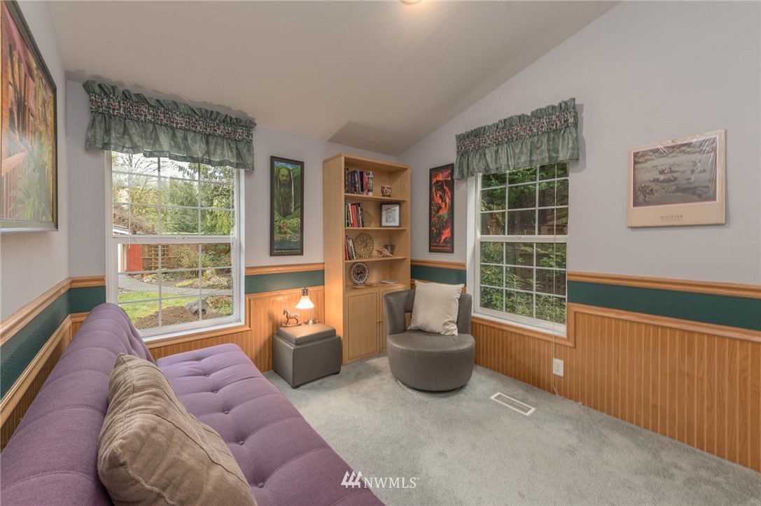 18109 Thorsen Road Southwest Vashon, WA 98070 - Photo 19 of 37 a living room with furniture and a window