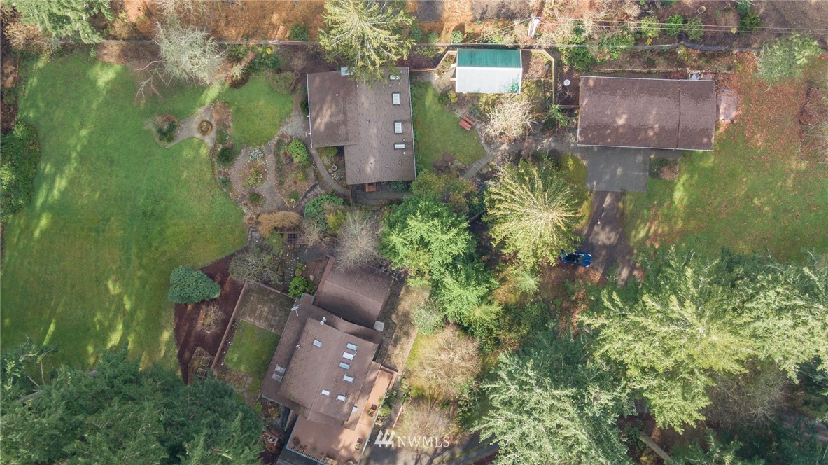 18109 Thorsen Road Southwest Vashon, WA 98070 - Photo 21 of 37 an aerial view of residential house with outdoor space and trees all around