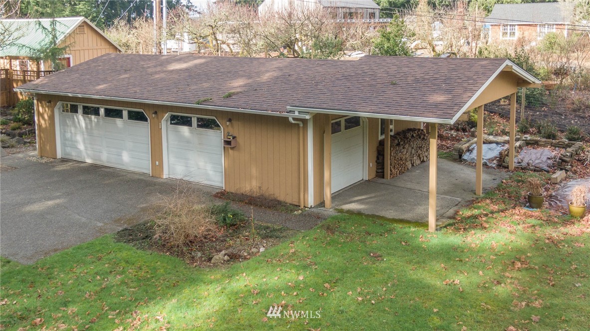 18109 Thorsen Road Southwest Vashon, WA 98070 - Photo 24 of 37 a view of a house with a yard