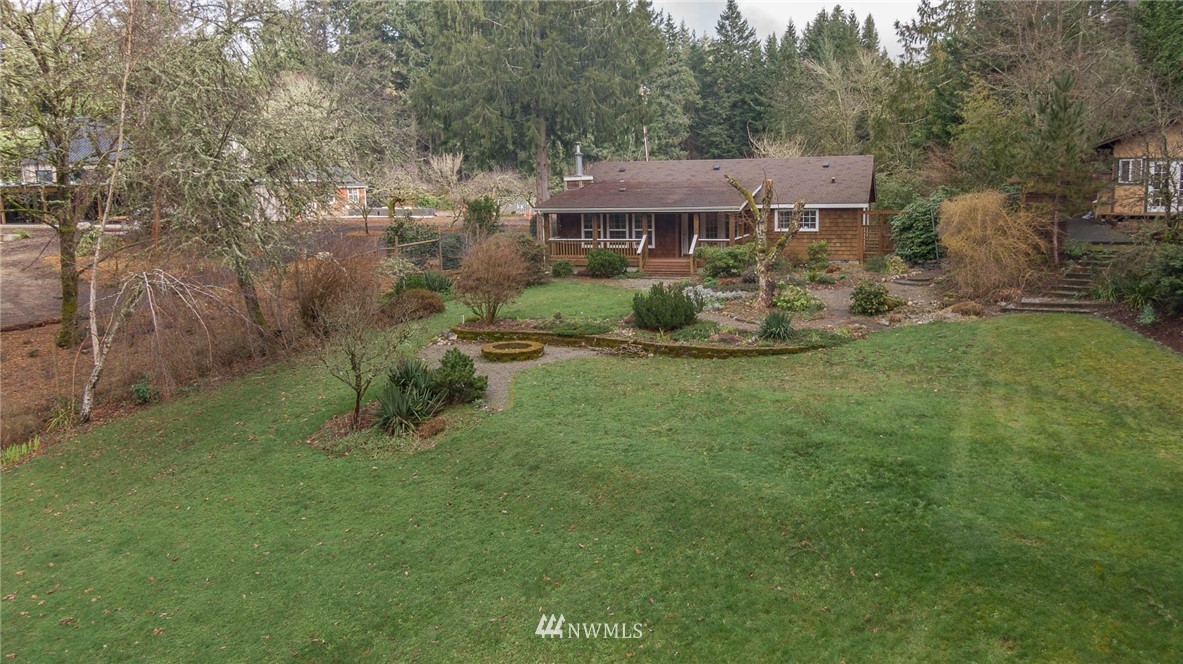 18109 Thorsen Road Southwest Vashon, WA 98070 - Photo 27 of 37 a view of a house with a yard