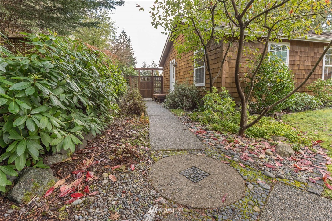 18109 Thorsen Road Southwest Vashon, WA 98070 - Photo 6 of 37 a view of a pathway both side of house