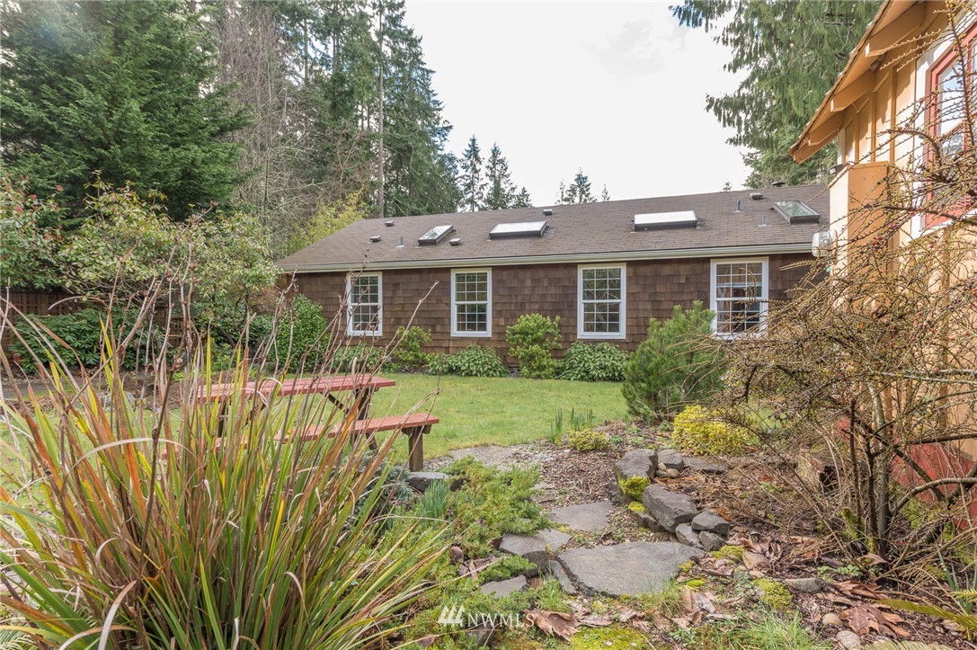 18109 Thorsen Road Southwest Vashon, WA 98070 - Photo 9 of 37 a view of a house with backyard and sitting area