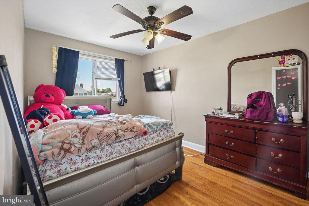 1918 Church Road Baltimore, MD 21222 - Photo 15 of 29 a bed room with a bed and a dresser