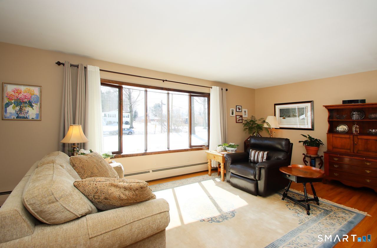 7 Old Forge Road North Haven, CT 06473 - Photo 11 of 40 a living room with furniture and a large window