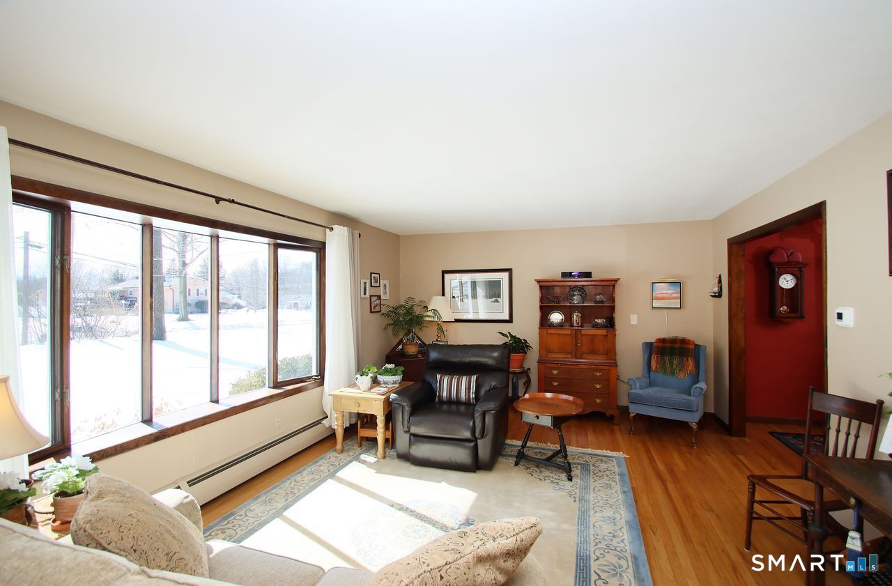 7 Old Forge Road North Haven, CT 06473 - Photo 12 of 40 a living room with furniture and a window