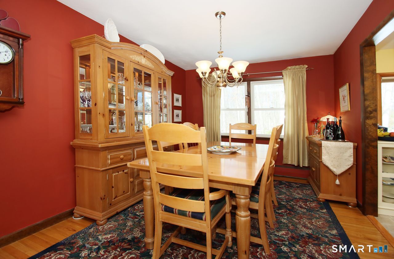 7 Old Forge Road North Haven, CT 06473 - Photo 15 of 40 a view of a dining room with furniture window and wooden floor