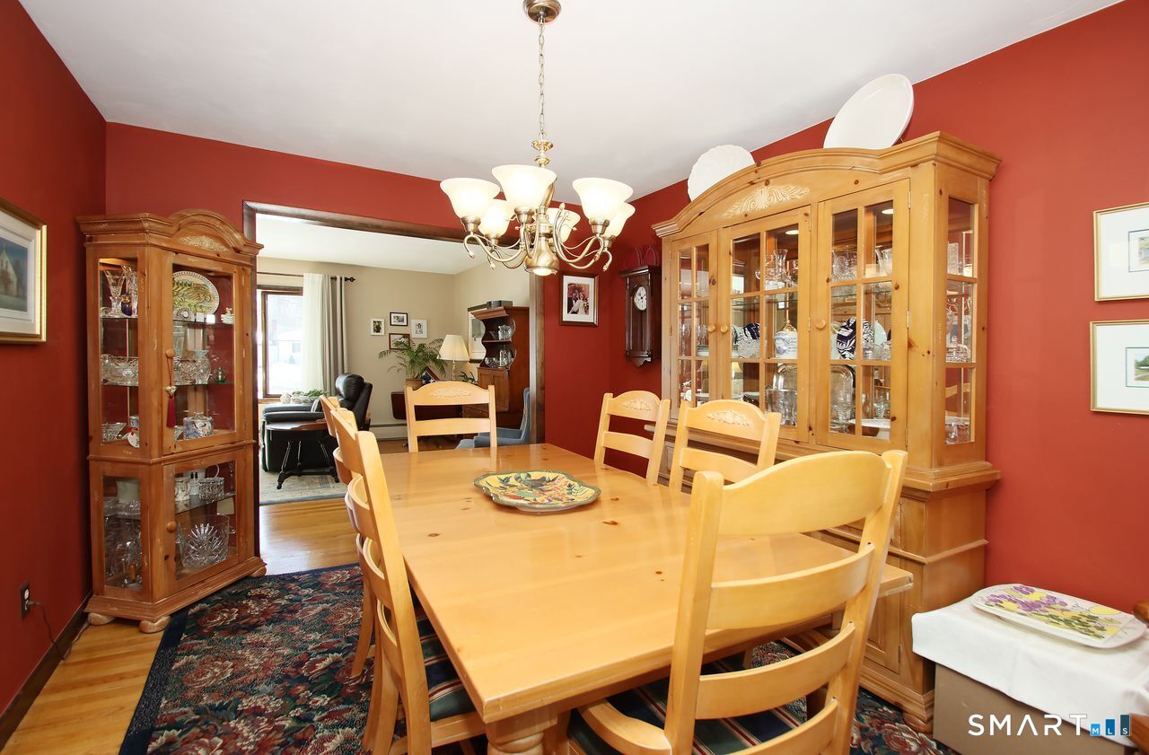 7 Old Forge Road North Haven, CT 06473 - Photo 16 of 40 a view of a dining room with furniture and wooden floor