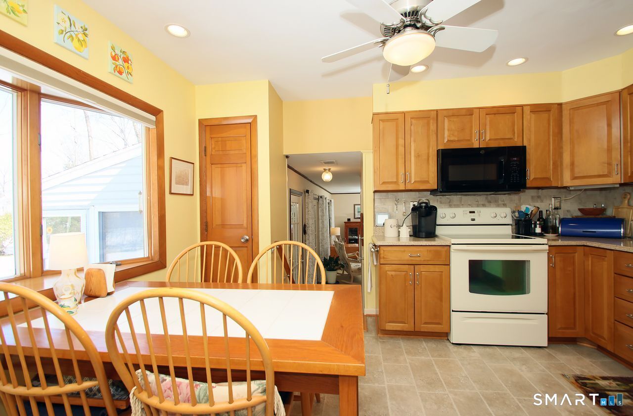 7 Old Forge Road North Haven, CT 06473 - Photo 18 of 40 a kitchen with a stove a sink and a refrigerator