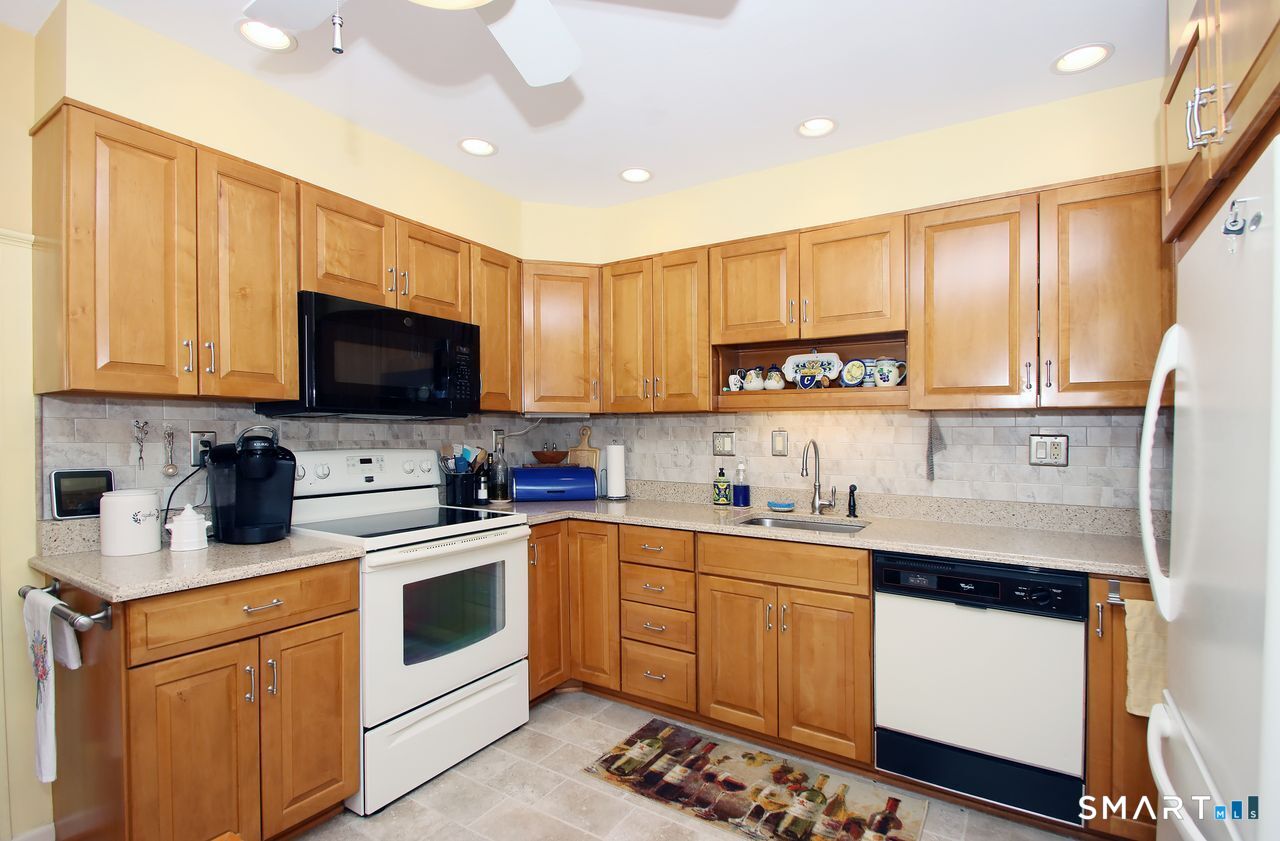 7 Old Forge Road North Haven, CT 06473 - Photo 19 of 40 a kitchen with a sink a stove and cabinets