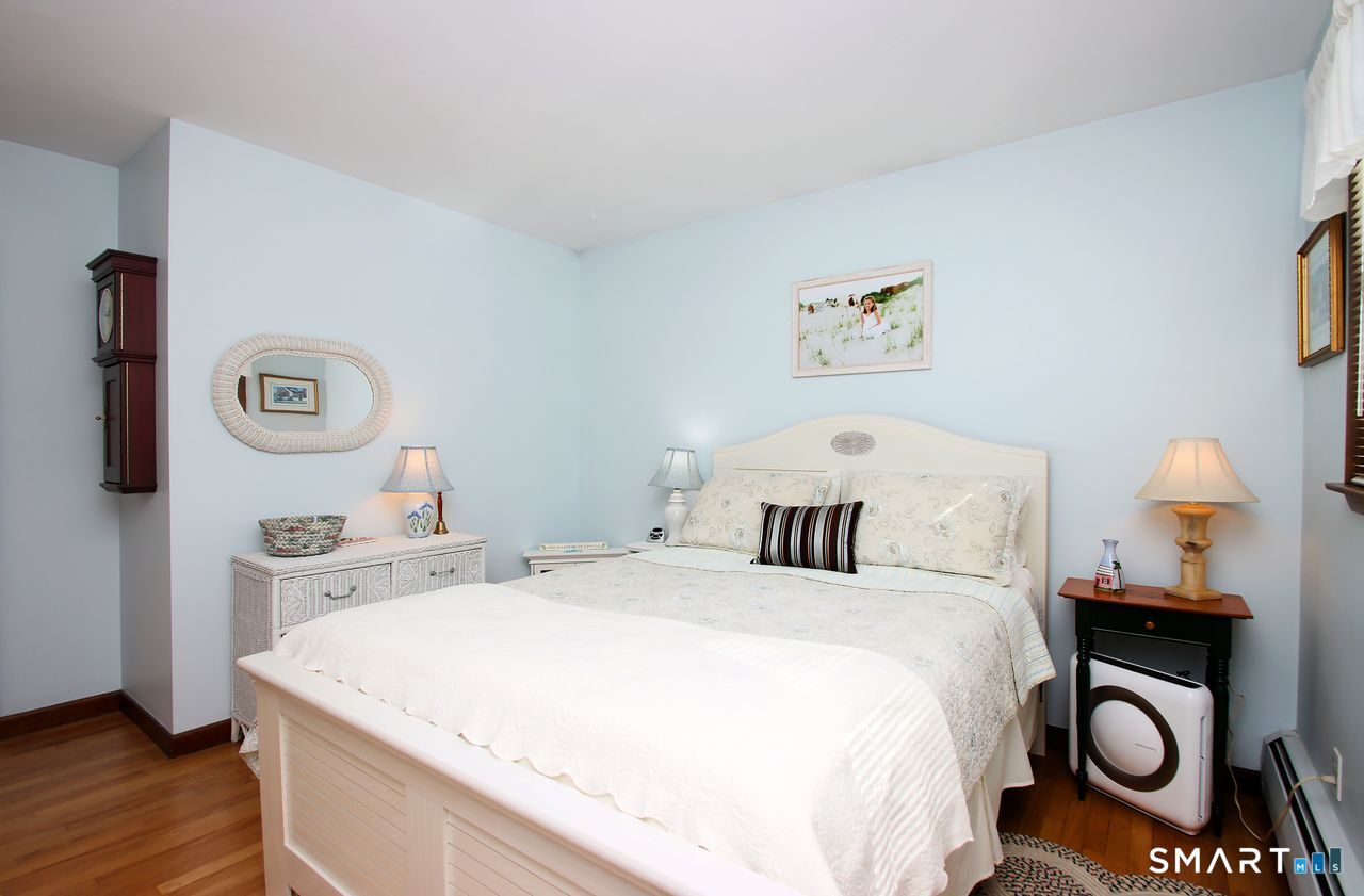 7 Old Forge Road North Haven, CT 06473 - Photo 26 of 40 a bed room with a bed and a lamp