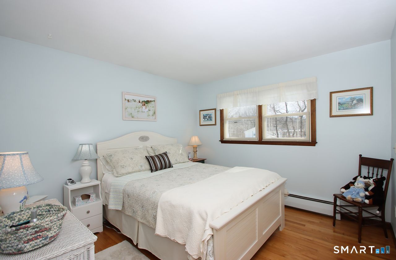 7 Old Forge Road North Haven, CT 06473 - Photo 27 of 40 a bedroom with a bed and wooden floor