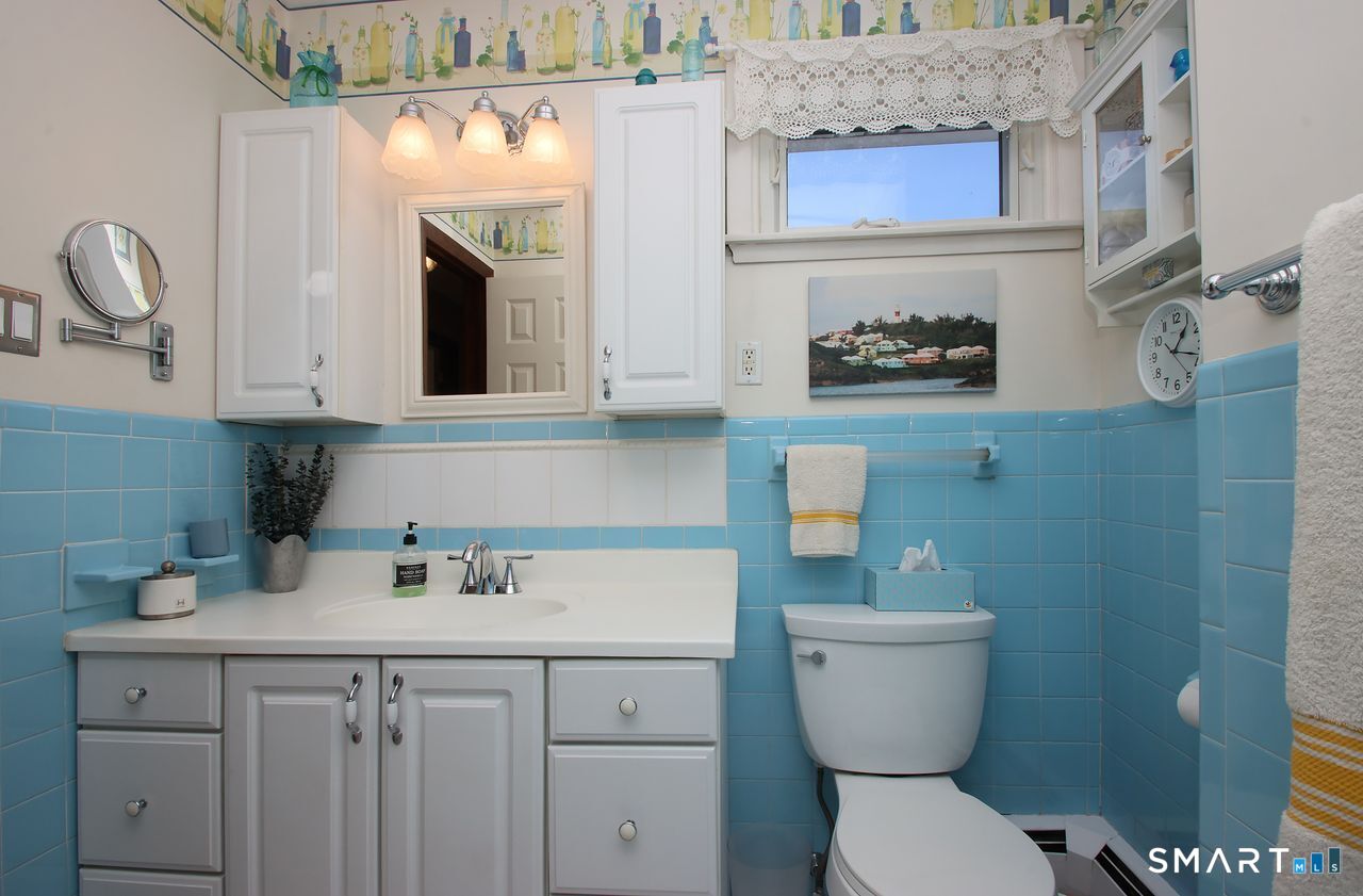 7 Old Forge Road North Haven, CT 06473 - Photo 29 of 40 a bathroom with a toilet a sink and mirror