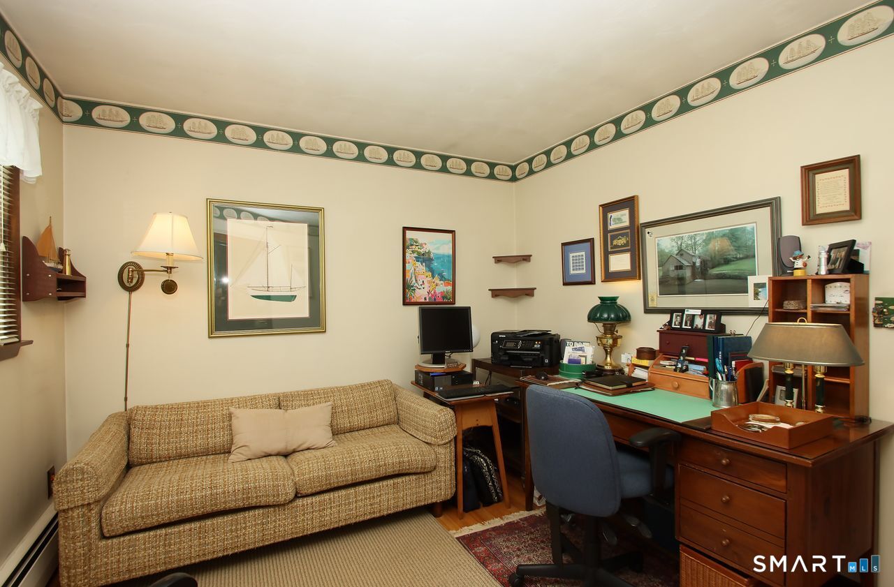7 Old Forge Road North Haven, CT 06473 - Photo 31 of 40 a living room with furniture and a flat screen tv