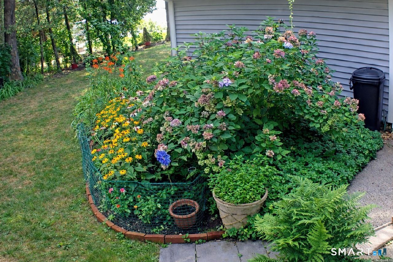 7 Old Forge Road North Haven, CT 06473 - Photo 37 of 40 a view of a garden with a flower garden