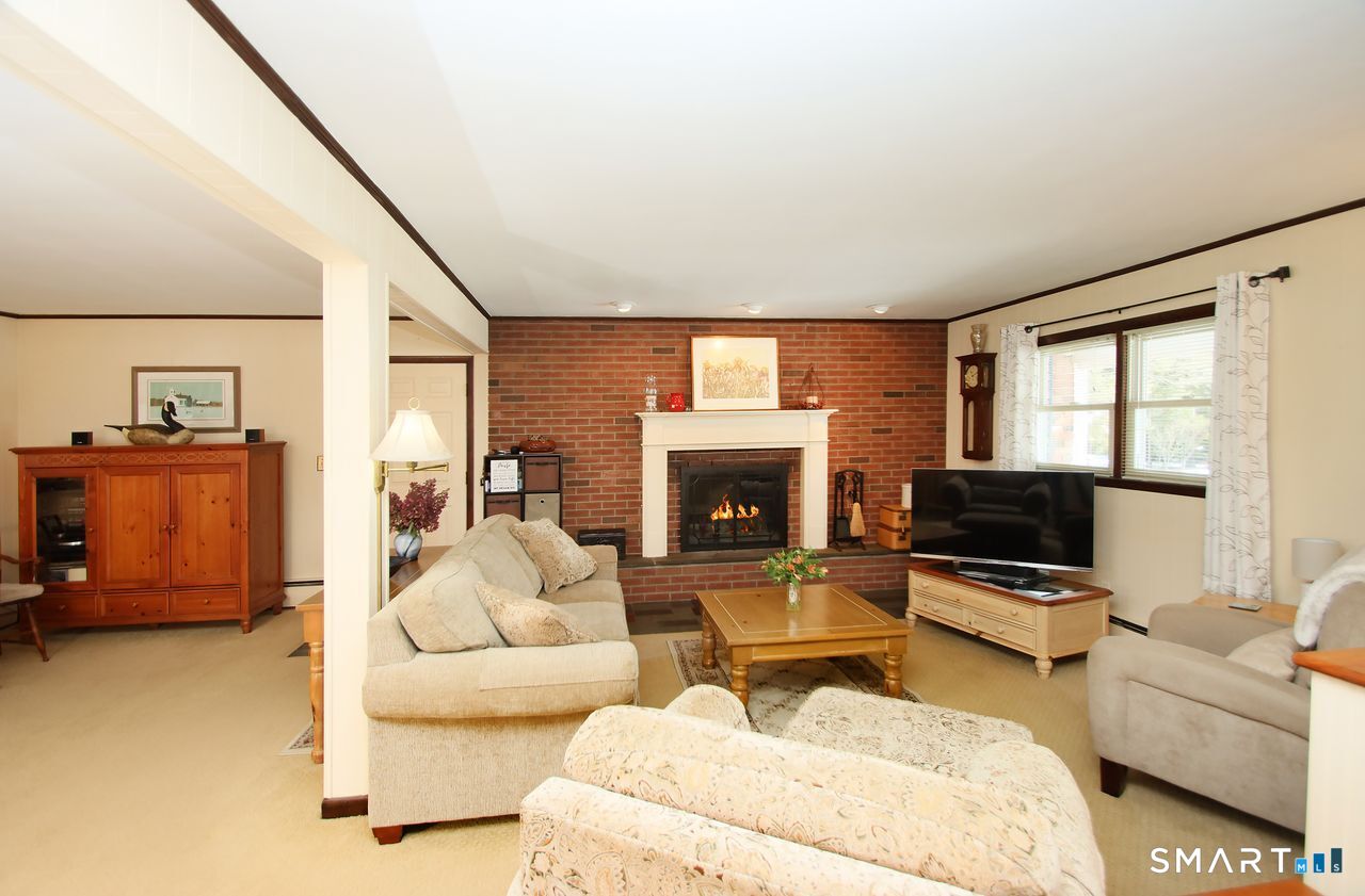7 Old Forge Road North Haven, CT 06473 - Photo 5 of 40 a living room with furniture and a fireplace